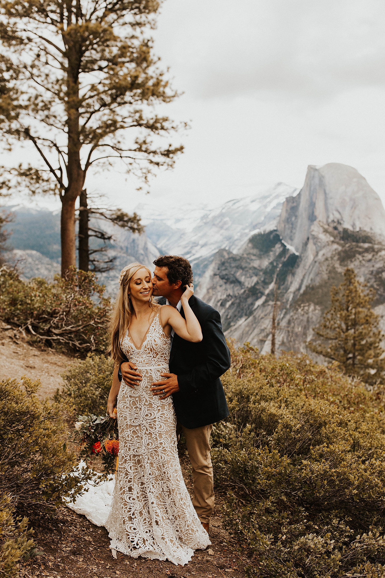 A bride and groom photo at Glacier Point in Yosemite National Park.