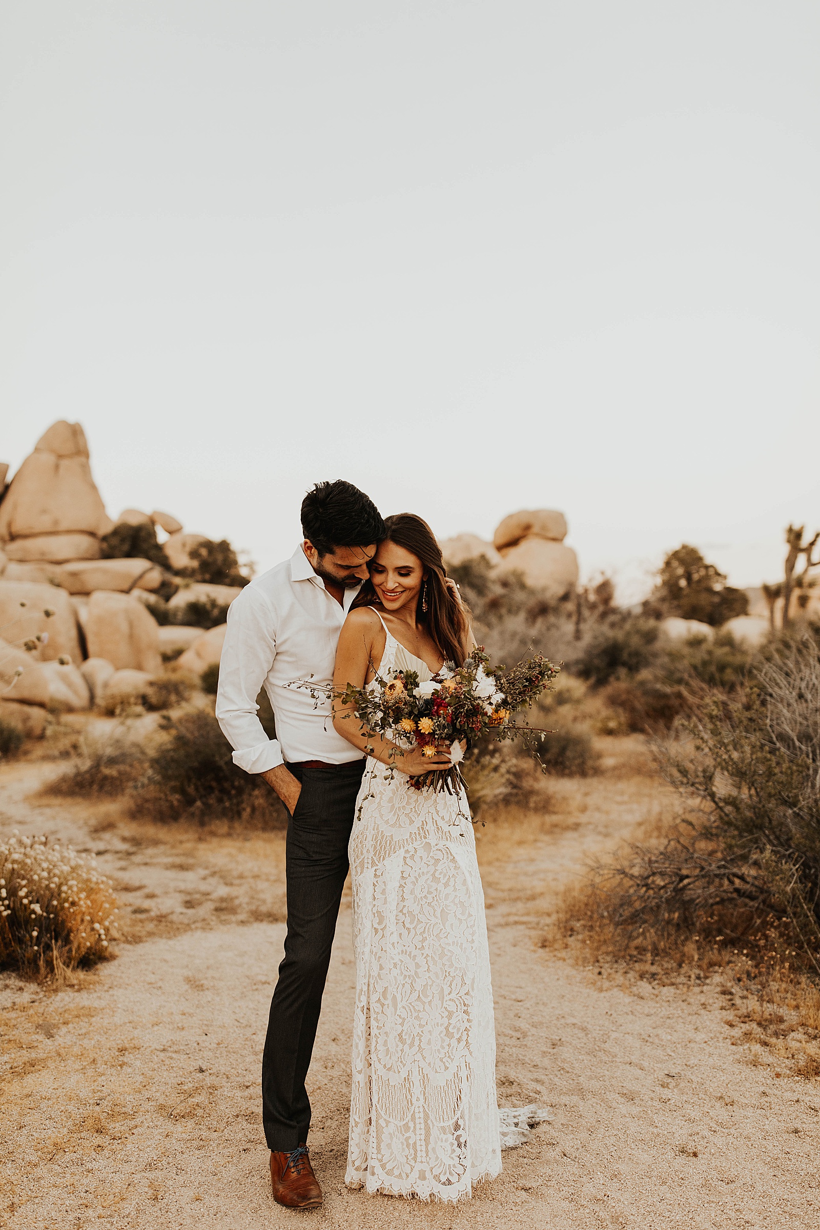 A bride and groom photo at their elopement in Hidden Valley, Joshua Tree National Park.