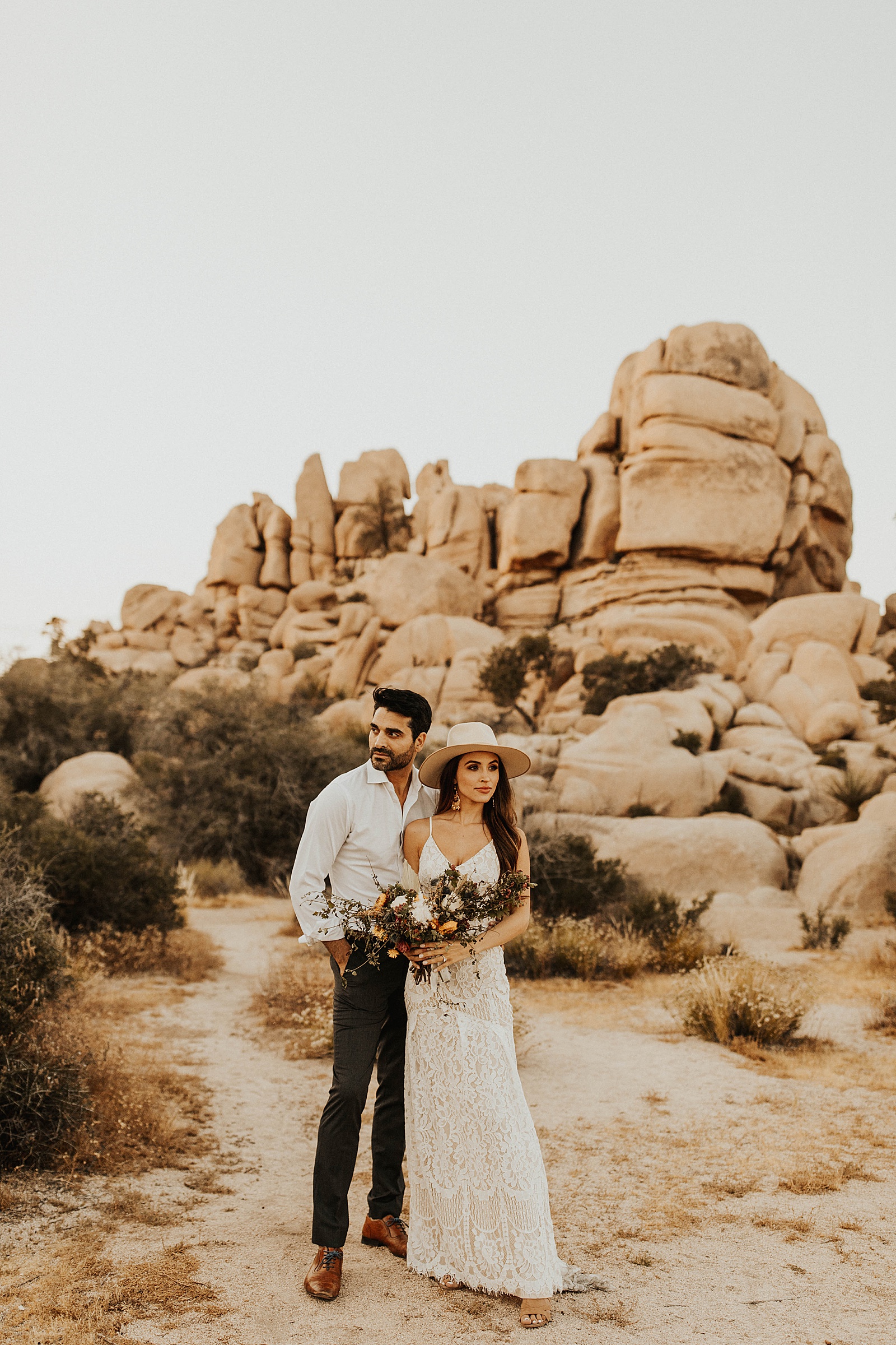 A bride and groom photo at their elopement in Hidden Valley, Joshua Tree National Park.