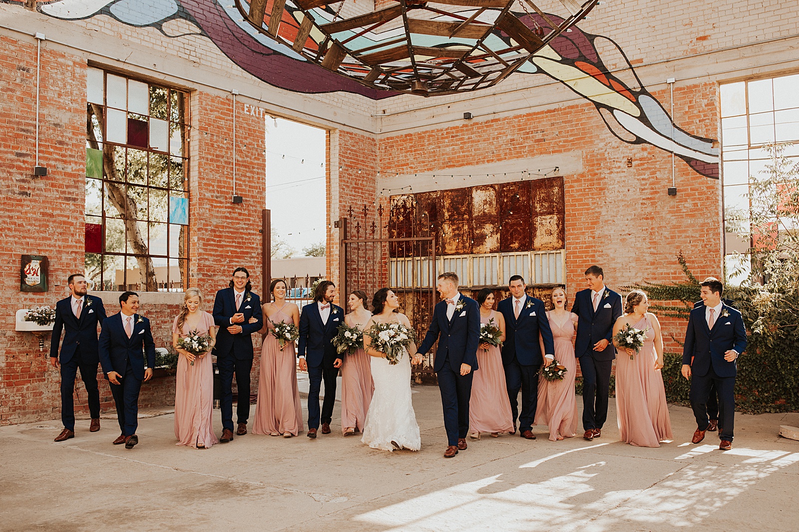 A bridal party wedding photo at the Soda District Courtyard in Abilene.