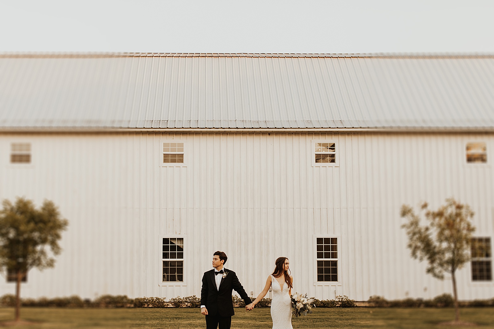 Bride and groom photos of this couple's gorgeous wedding at the White Sparrow Barn near Dallas, TX. 