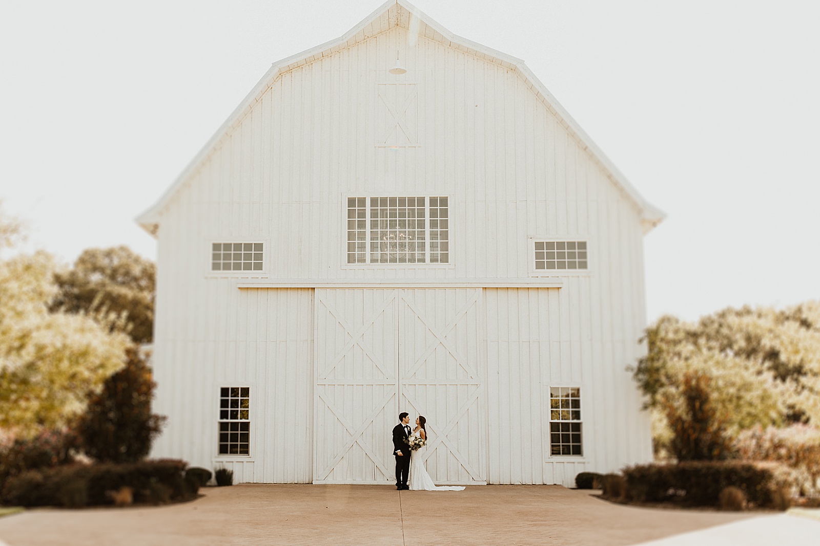 A bride and groom photo at their wedding at the White Sparrow Barn in Dallas, TX. 
