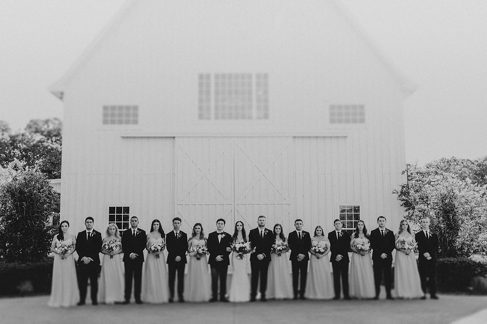 A bridal party photo at a wedding at the White Sparrow Barn in Dallas, TX. 