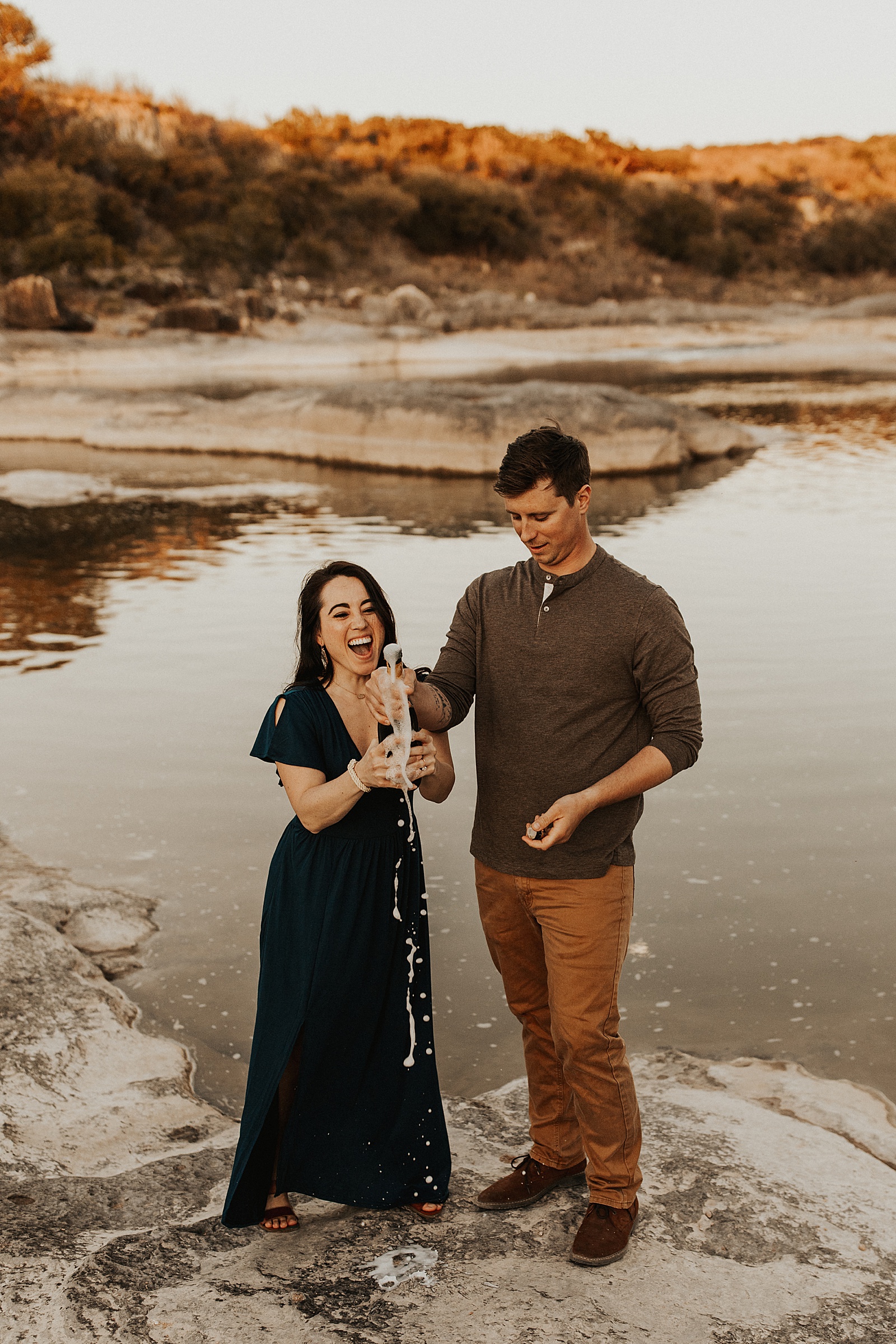 These two enjoyed some pizza and champagne for their Pedernales Falls engagement session in Austin, TX.