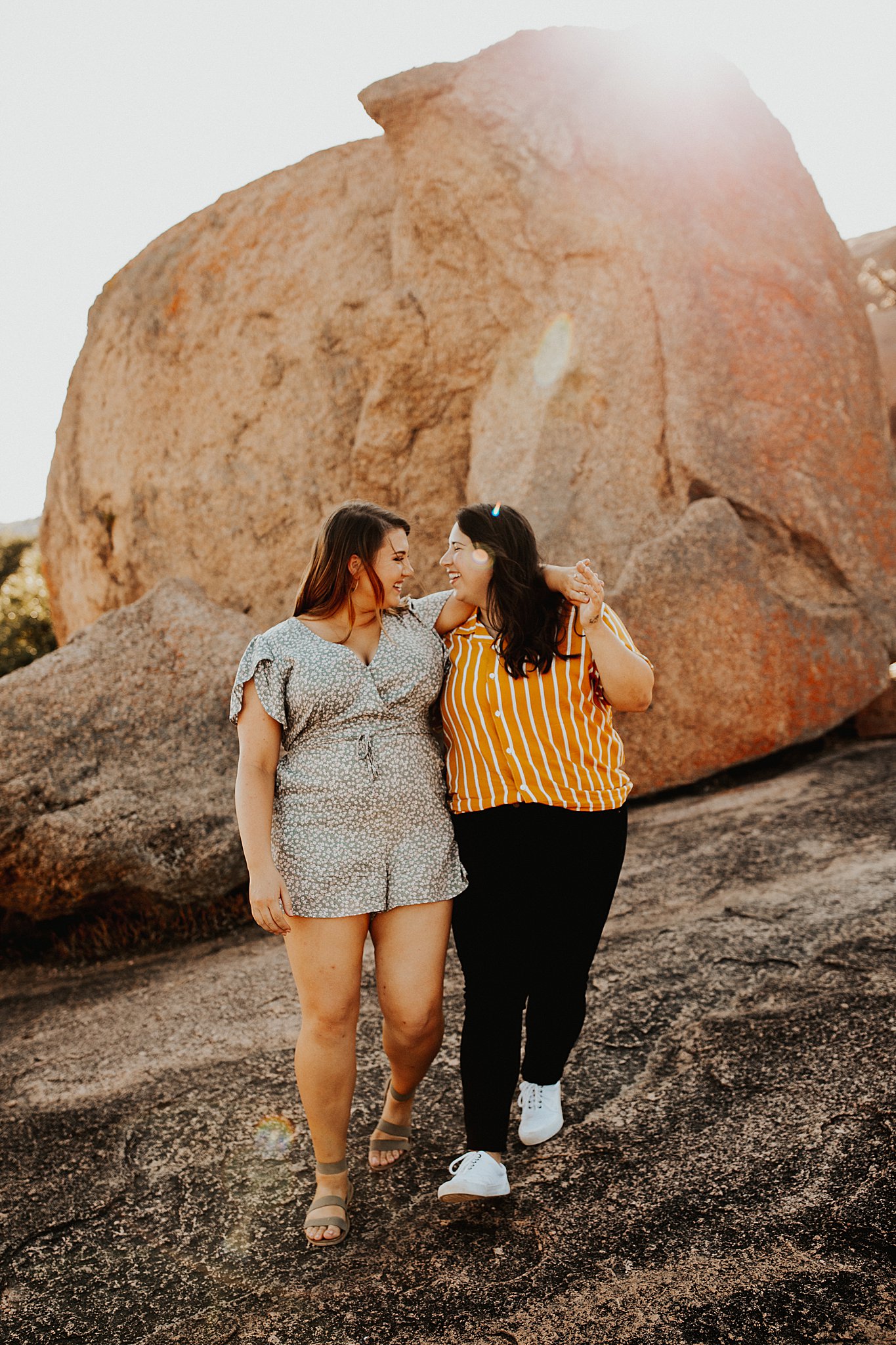 A gorgeous lesbian couple at their Enchanted Rock Engagement session. 