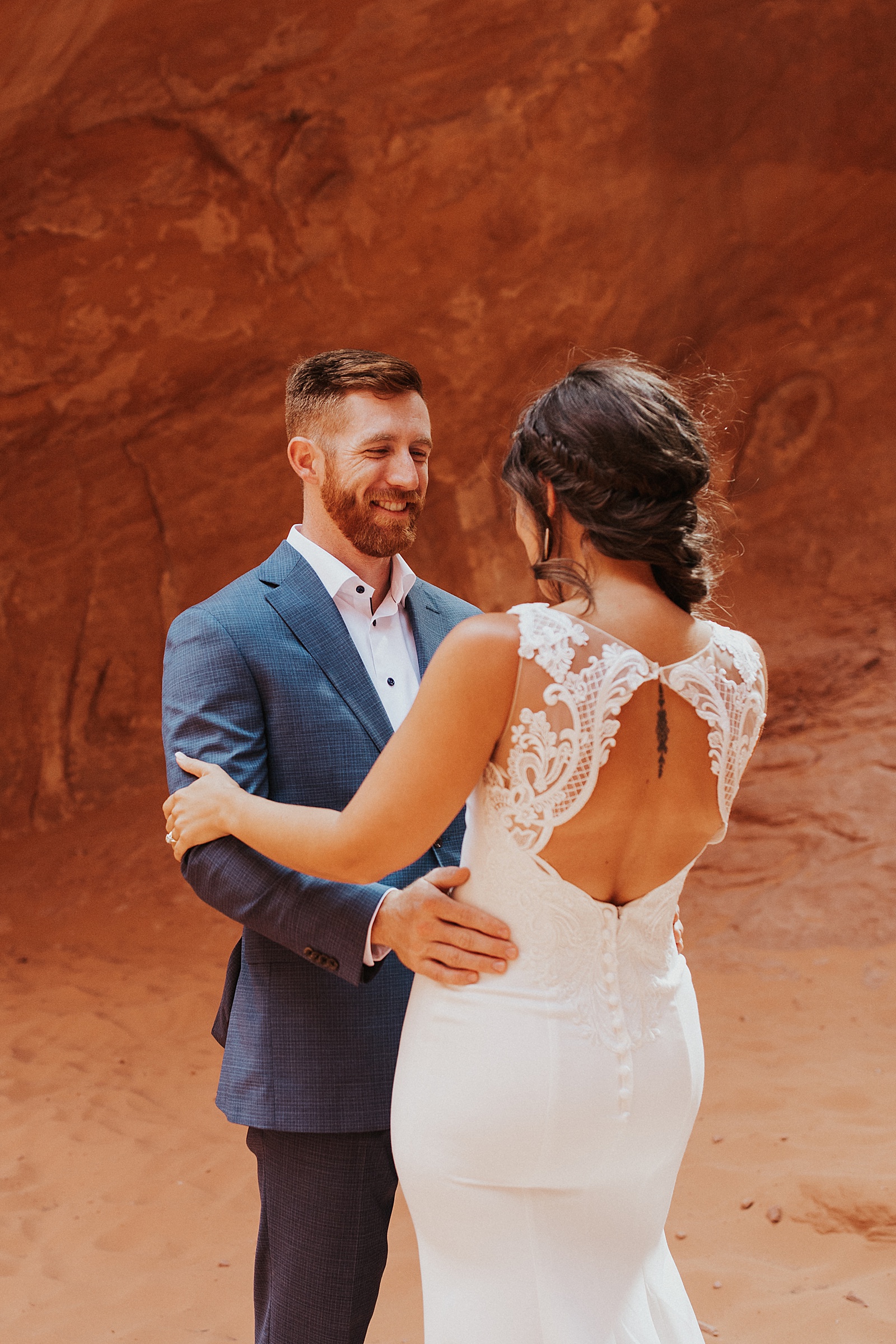 Gorgeous bride and groom at their boho Arches National Park wedding. 