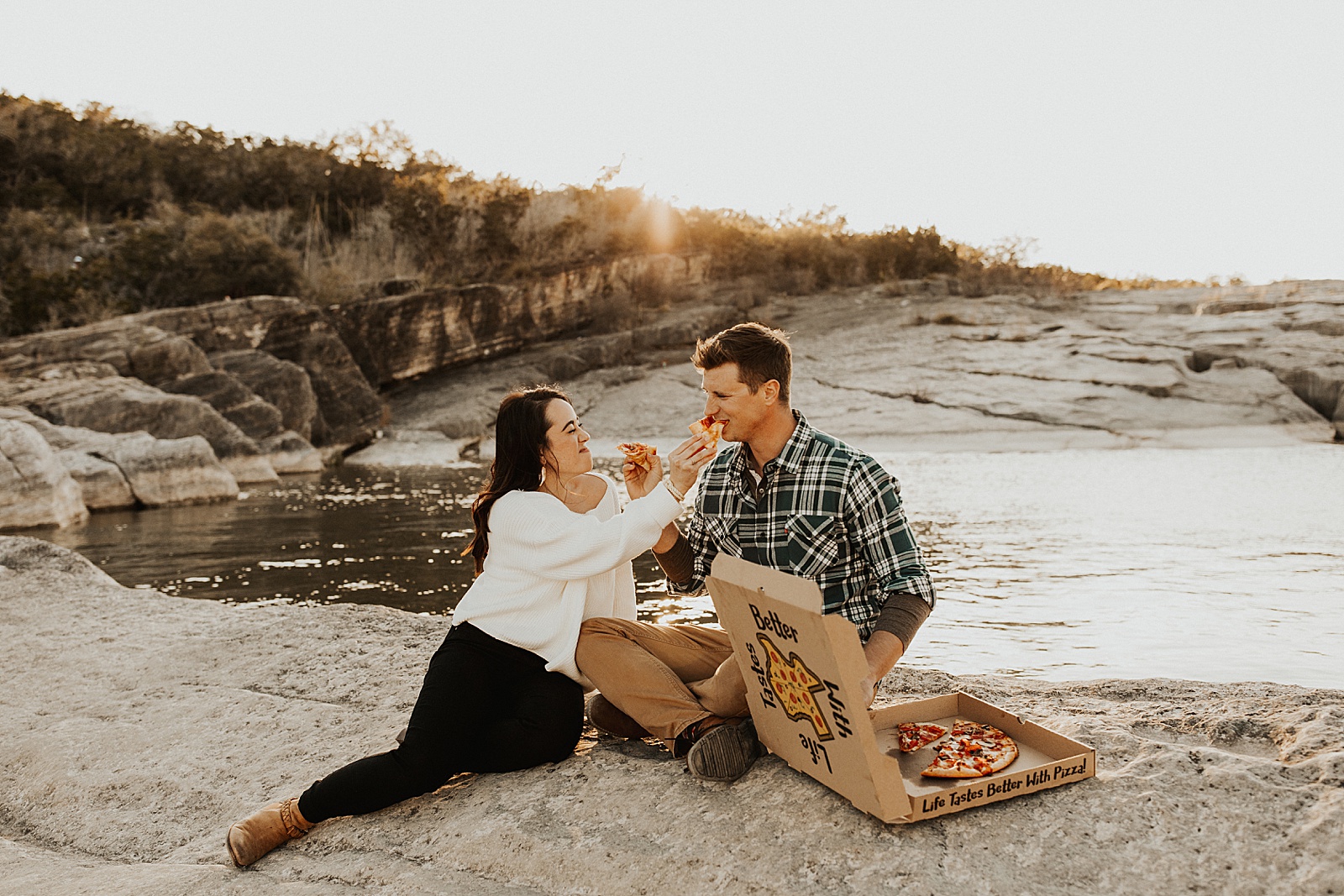 These two enjoyed some pizza and champagne for their engagement photos at Pedernales Falls State Park in Austin, TX.