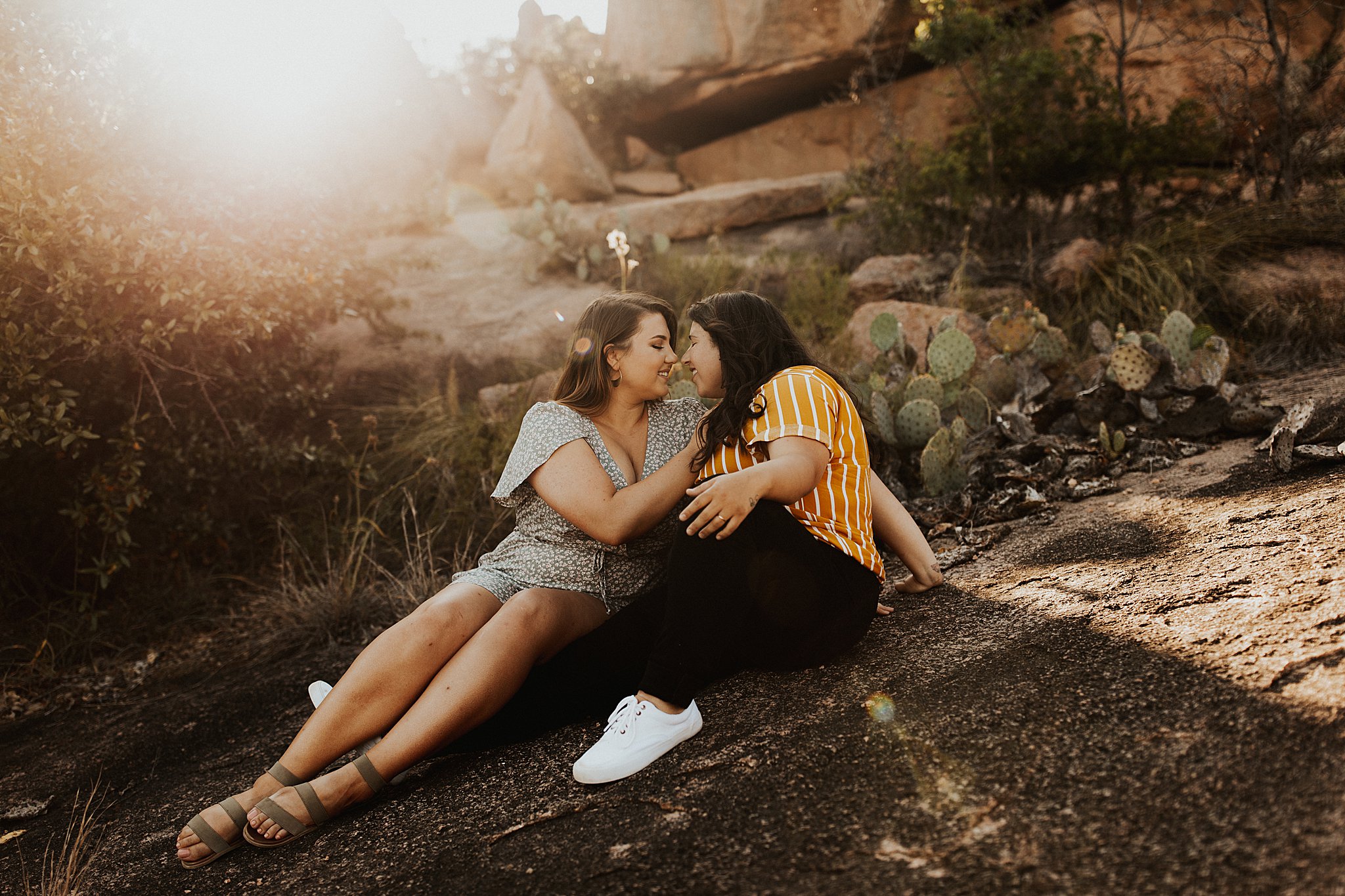 A gorgeous lesbian couple at their Enchanted Rock Engagement session.