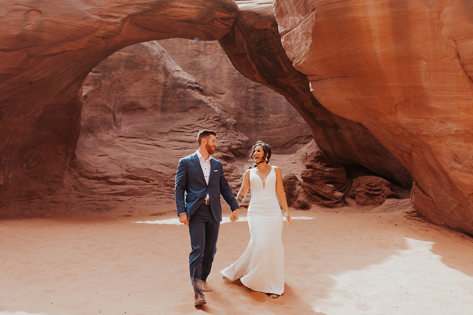 Gorgeous bride and groom at their boho Arches National Park wedding.